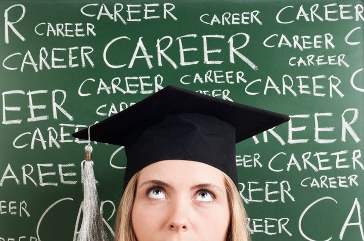 thinking young woman student in front of 'career' words written blackboard