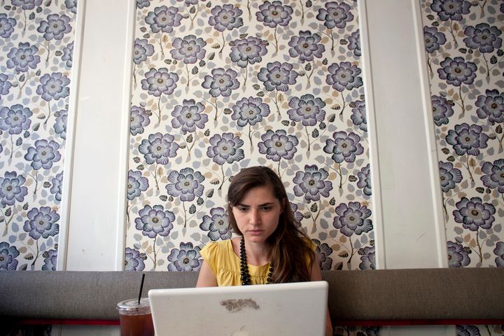 NEW YORK - JULY 25: Matilde Hoffman works on her computer at a coffee shop July 25, 2012 in New York City. Matilda graduated from University of Southern California in December of 2011 with a bachelors degree in neuroscience. Since graduating she has applied to over 30 different jobs, gone on 3 interviews, and had no luck finding a full time job. In the meantime she has been working two part time hostess jobs and volunteering with New York Cares. In June, on a whim, she applied to a one year medical science program at Drexel University at was recently accepted. ''I was tired of the job search. All this looking for a job, volunteering and shuffling around to two part time jobs was getting stressful. If that's the only opportunity I have, if nothing else comes my way, I should do it. If this is what life has brought to me at the moment I should take it.'' she said. From 2000 to 2010 the number of waiters and waitresses ages 18 to 30 with college degrees increased 81 percent according to the U.S. Census Bureau. Educated bartenders, dishwashers in that age group doubled. Recently the Associated Press reported that ''About 1.5 million, or 53.6 percent, of bachelor's degree-holders under the age of 25 last year were jobless or underemployed, the highest share in at least 11 years.'' (Photo by Allison Joyce/Getty Images)