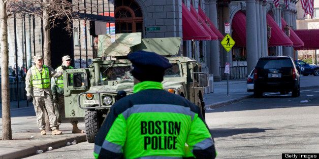 BOSTON, MA - APRIL 16: Boston police and members of the military stand guard on the streets around Copley Square the day after two bombs exploded at the finish of the Boston Marathon, on April 16, 2013 in Boston, Massachusetts. The city is cordoned off around the bomb site and filled with law enforcement officials, federal and state. Officials are calling it a terrorist attack (Photo by Melanie Stetson Freeman/The Christian Science Monitor via Getty Images)