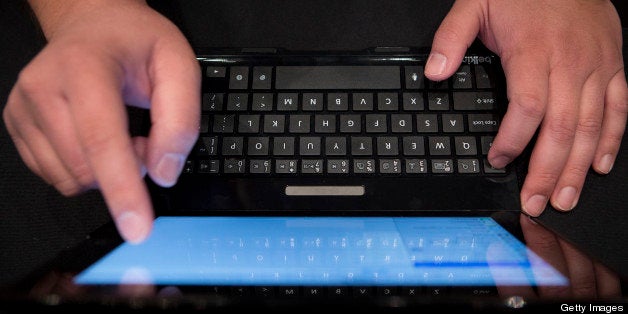 An employee types on a Belkin International Inc. 'Ultimate' tablet keyboard at Pepcom DigitalFocus in New York, U.S., on Thursday, April 11, 2013. DigitalFocus is Pepcom's annual Spring showcase that previews the tablets, laptops, smartphones, gadgets, videogames, toys, and consumer electronics that will be hot items for the gift-giving season. Photographer: Scott Eells/Bloomberg via Getty Images