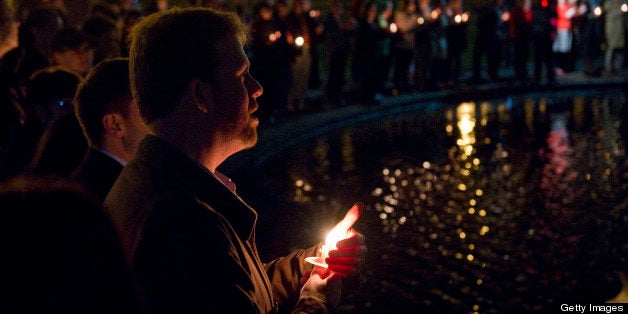 BOSTON, MASSACHUSETTS - APRIL 16: Mourners of the victims of the Boston Marathon explosion gather, light candles and sing in the Boston Public Garden during a candlelight vigil held by the Arlington Street Unitarian Universalist Church on April 16, 2013 in Boston, Massachusetts. (Photo by Ann Hermes/The Christian Science Monitor via Getty Images)