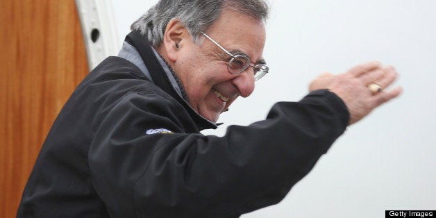 U.S. Defense Secretary Leon Panetta (C) salutes as he boards a plane for California after returning from NATO meetings in Brussels on February 22, 2013 at Joint Base Andrews, Maryland. AFP PHOTO POOL/CHIP SOMODEVILLA (Photo credit should read CHIP SOMODEVILLA/AFP/Getty Images)