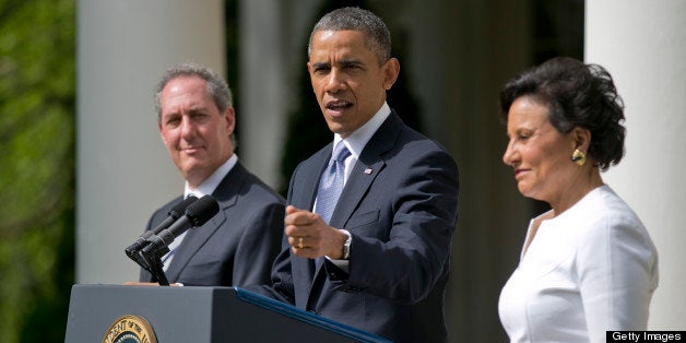 Penny Pritzker, chairman, president and chief executive officer of Pritzker Realty Group LLC and U.S. President Barack Obama's nominee as secretary of commerce, right, and Michael Froman, deputy national security adviser for international economics and U.S. President Barack Obama's nominee as U.S. trade representative, left, listen as U.S. President Barack Obama makes an announcement in the Rose Garden of the White House in Washington, D.C., U.S., on Thursday, May 2, 2013. In nominating Pritzker, the Chicago billionaire and Hyatt Hotels Corp. heiress, Obama is choosing someone who potentially will face aggressive questioning from Republicans during confirmation hearings because of her complex financial portfolio. Photographer: Andrew Harrer/Bloomberg via Getty Images 