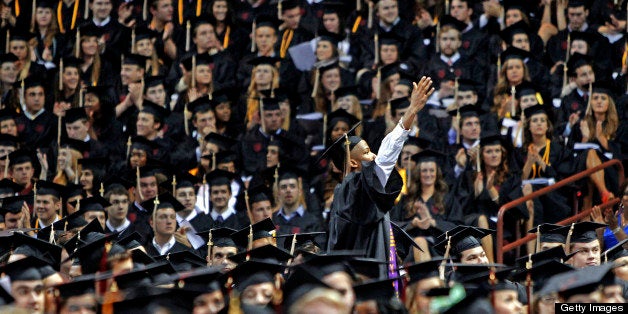 A University of South Carolina graduate looks to his family during the school's commencement ceremony in Columbia, South Caro