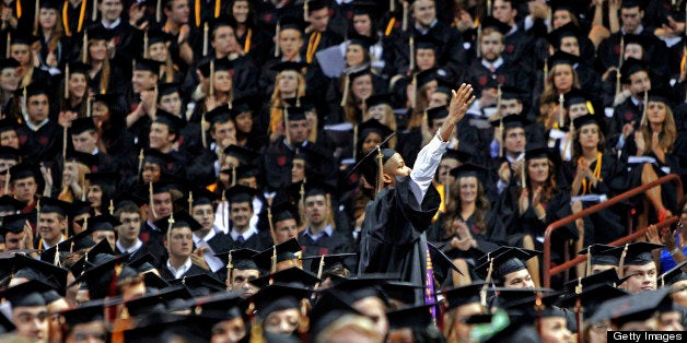 A University of South Carolina graduate looks to his family during the school's commencement ceremony in Columbia, South Carolina, on Friday, May 10, 2013. (Gerry Melendez/The State/MCT via Getty Images)