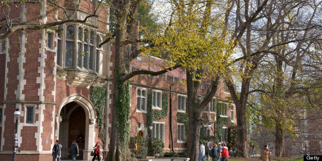 Students walking to classes near building in the Collegiate Gothic style, Princeton University, Princeton, NJ, USA