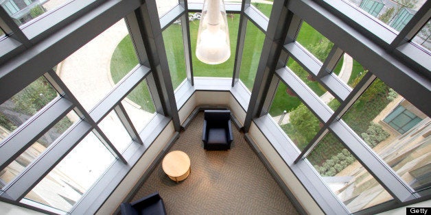 Furniture sits in a lounge on the first level of the faculty offices at the MIT Sloan School of Business Management's new building in Cambridge, Massachusetts, U.S., on Monday, Aug. 23, 2010. Elite business schools are locked in an 'arms race' of building bigger and more elaborate business campuses to recruit the best students and faculty and climb magazine rankings, says Yale finance professor Matthew Spiegel. Photographer: Kelvin Ma/Bloomberg via Getty Images