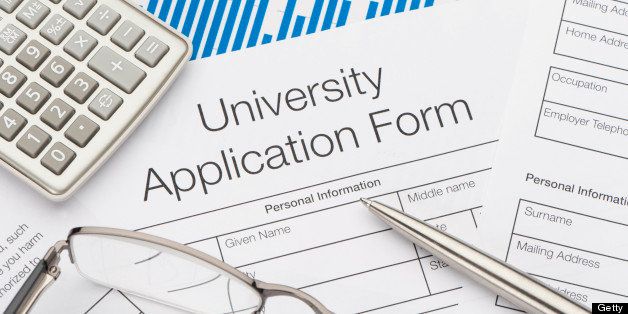 University application form with pen and calculator