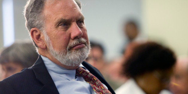 John Sexton, president of New York University, listens to Timothy Geithner, U.S. treasury secretary, at NYU in New York, U.S.