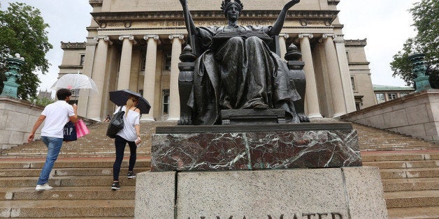 NEW YORK, NY - JULY 01: People walk past the Alma Mater statue on the Columbia University campus on July 1, 2013 in New York