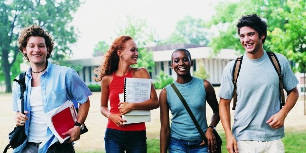 Four Students Walking on Campus