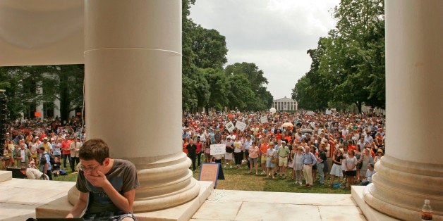 CHARLOTTESVILLE, VA-JUNE 24, 2012-CAPTION: Aaron Eisen, 20, a 4th year Economics and English major, tweets for the school newspaper while faculty speak. Over 1,500 students, professors and local citizens turned out forÊ'Rally for Honor' on theÊLawn on the campus of the University of Virginia, two days before the school's board reconsiders its decision. During the two-hour rally, faculty membersÊcalled for the UVA Board of Visitors to reinstateÊousted president Teresa Sullivan.ÊOn Friday Gov. Bob McDonnell threatened to replace the entire board if it fails to resolve the matter. (Photo by Jay Paul for The Washington Post via Getty Images)