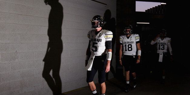 TEMPE, AZ - OCTOBER 12: Quarterbacks Connor Wood #5 and Stevie Joe Dorman #18 of the Colorado Buffaloes walk out onto the field before the college football game against the Arizona State Sun Devils at Sun Devil Stadium on October 12, 2013 in Tempe, Arizona. (Photo by Christian Petersen/Getty Images)