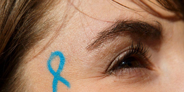 Carly Mee, a student at Occidental College, wears a blue ribbon painted on her face to raise awareness of sexual assault at Occidental College in Los Angeles, California, U.S., on Friday, April 19, 2013. A group of Occidental students and alumni filed a Title IX complaint with the Education Department on April 18 saying the school doesnt meet federal standards for preventing and responding to rapes and other sexual assaults on campus. Photographer: Patrick Fallon/Bloomberg via Getty Images 