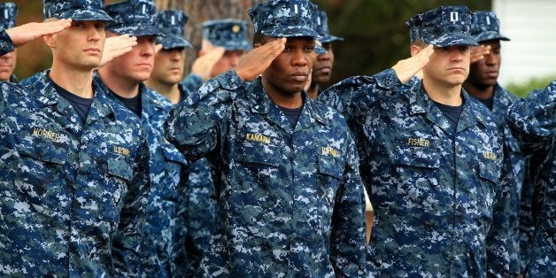 Soldiers salute as the National Anthem is played during Fort Jackson's annual Veterans Day wreath laying ceremony, Thursday,