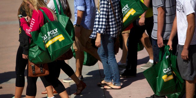 New students carry bags during orientation on the campus of California Polytechnic State University San Luis Obispo (Cal Poly SLO) in San Luis Obispo, California, U.S., on Friday, Sept. 20, 2013. Universities often are susceptible to the Interfraternity Conferences pressure to recruit freshmen because Greek life appeals to applicants and many alumni donors remain loyal to their fraternities. Photographer: Patrick T. Fallon/Bloomberg via Getty Images