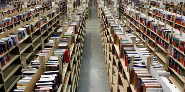 Textbooks sit on shelves at the Chegg Inc. warehouse in Shepherdsville, Kentucky, U.S., on Thursday, April 29, 2010. No more