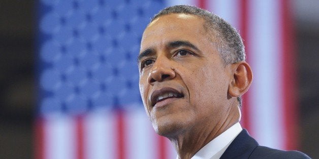 US President Barack Obama speaks at MacGavock High School in Nashville, Tennessee on January 30, 2014. AFP PHOTO/Mandel NGAN