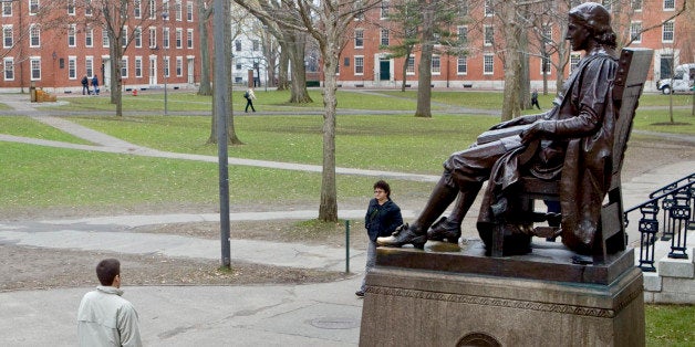 A statue of John Harvard sits in Harvard Yard on the school's campus in Cambridge, Massachusetts, U.S., on Tuesday, Dec. 15,