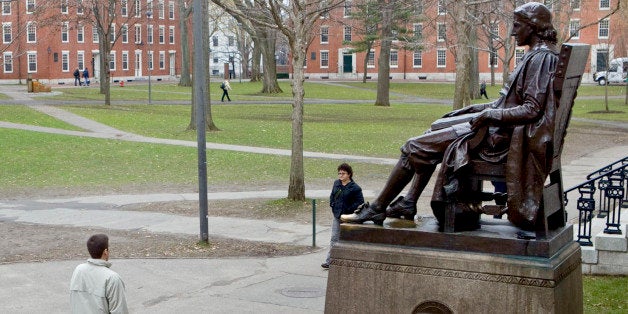 A statue of John Harvard sits in Harvard Yard on the school's campus in Cambridge, Massachusetts, U.S., on Tuesday, Dec. 15, 2009. Harvard, the oldest and richest college in the U.S., paid almost $1 billion to terminate a wrong-way bet on interest rate swaps that it had entered in 2004 to finance expansion in Allston. Photographer: Michael Fein/Bloomberg via Getty Images