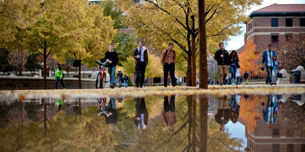 Students walk on the Purdue Mall on the campus of Purdue University in West Lafayette, Indiana, U.S., on Monday, Oct. 22, 2012. Administrative costs on college campuses are soaring, crowding out instruction at a time of skyrocketing tuition and $1 trillion in outstanding student loans. At Purdue and other U.S. college campuses, bureaucratic growth is pitting professors against administrators and sparking complaints that tight budgets could be spent more efficiently. Photographer: Daniel Acker/Bloomberg via Getty Images