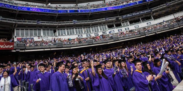 NEW YORK, NY - MAY 21: Students celebrate at the commencement of the 2014 New York University graduation ceremony at Yankee Stadium on May 21, 2014 in the Bronx borough of New York City. Janet Yellen, Chair of the Board of Governors of the Federal Reserve System, received an honorary doctorate and was the 2014 commencement speaker. (Photo by Andrew Burton/Getty Images)