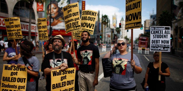 LOS ANGELES, CA - SEPTEMBER 22: Students protest the rising costs of student loans for higher education on Hollywood Boulevard on September 22, 2012 in the Hollywood section of Los Angeles, California. Citing bank bailouts, the protesters called for student debt cancelations. (Photo by David McNew/Getty Images)