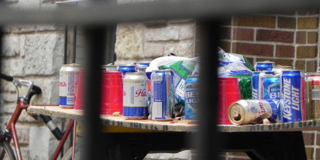 Empty beverage containers on a makeshift table in the courtyard of a Madison, Wisconsin fraternity house across from Badger s