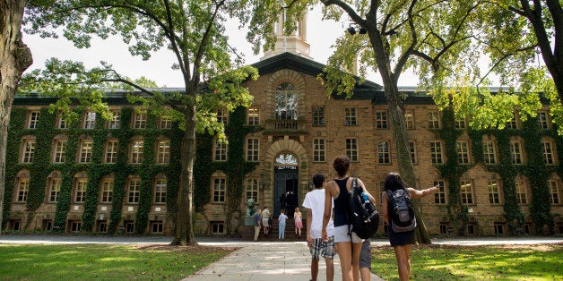 People walk on the Princeton University campus in Princeton, New Jersey, U.S., on Friday, Aug. 30, 2013. Residents in Princeton, New Jersey, have sued the municipality and the university, saying the school should lose its tax-exempt status because it shares royalties from patents with faculty. Photographer: Craig Warga/Bloomberg via Getty Images