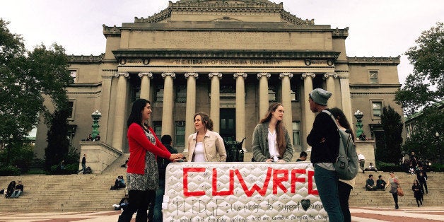 NEW YORK, NY - OCTOBER 29 : Students stand in front of the Library of the Columbia University with a mattress in support of