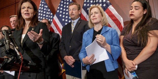 From left, Sen. Kelly Ayotte, R-N.H., Sen. Dean Heller, R-Nev., Sen. Kirsten Gillibrand, D-N.Y., and Anna, a survivor of sexual assault, appear at a news conference on Capitol Hill in Washington, Wednesday, July 30, 2014, to discuss "Campus Accountability and Safety Act" that is before the Senate. Anna was an 18 year old student at Hobart and William Smith Colleges in central New York when she was sexually assaulted by fellow students at a fraternity party, just three weeks into her freshman year. (AP Photo/J. Scott Applewhite)