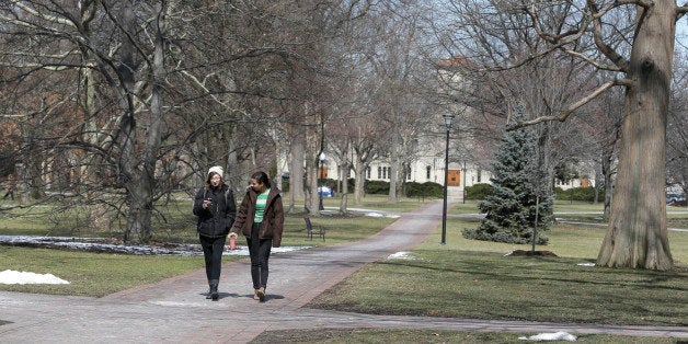 Two students walk on the campus of Oberlin College Tuesday, March 5, 2013, in Oberlin, Ohio. Oberlin College says it can