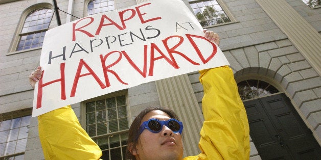 Austin Lin, a Harvard University graduate, class of 1989, from Cambridge, Mass., joins a rally Wednesday, May 15, 2002 outside of University Hall at Harvard University, organized by The Coalition Against Sexual Violence, against a new school procedure for investigating student sexual misconduct. (AP Photo/Michael Manning)