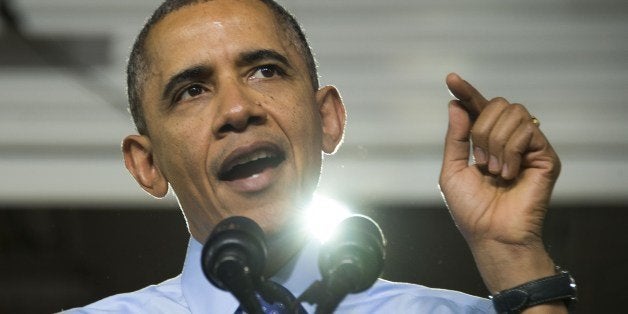 US President Barack Obama gives remarks after touring the Mechatronics class at the Community College of Allegheny County West Hills Center in Oakdale, Pennsylvania, April 16, 2014. AFP PHOTO / Jim WATSON (Photo credit should read JIM WATSON/AFP/Getty Images)