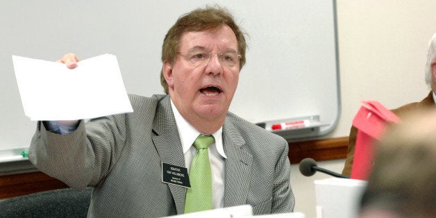 Sen. Ray Holmberg, R-Grand Forks, passes out amendments during a Senat Appropriations Committee meeting at the Capitol in Bis