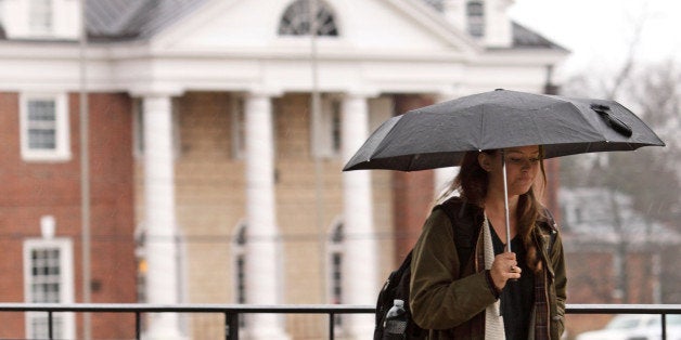 CHARLOTTESVILLE, VA - DECEMBER 6: Kathryn Dockter, at third year student at the University of Virginia, walks past the Phi Kappa Psi fraternity house on December 6, 2014 in Charlottesville, Virginia. On Friday, Rolling Stone magazine issued an apology for discrepencies that were published in an article regarding the alleged gang rape of a University of Virginia student by members of the Phi Kappa Psi fraternity. (Photo by Jay Paul/Getty Images)