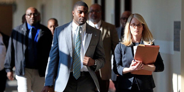 Former Vanderbilt football player Cory Batey, front left, arrives for jury selection in his rape trial Monday, Nov. 3, 2014, in Nashville, Tenn. Batey and former teammate Brandon Vandenburg are charged with the rape of an unconscious 21-year-old female student on June 23, 2013. (AP Photo/Mark Humphrey)