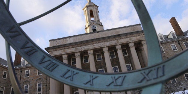 This is Old Main on the Penn State University campus Friday, Nov 28, 2014 in State College, Pa. (AP Photo/Gene J. Puskar )