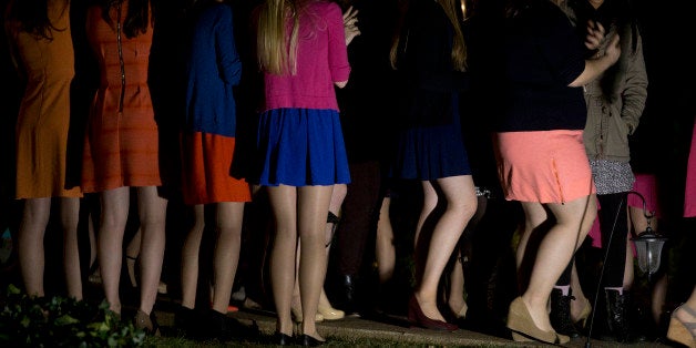 Sorority sisters clap as potential new members leave the house during spring fraternity rush near the University of Virginia (UVA) campus in Charlottesville, Virginia, U.S., on Friday, Jan. 16, 2015. This year's rush week at UVA, the prolonged annual rite in which fraternities and sororities recruit new members, carries fresh significance. Depending on who you talk to, the student rituals embody either an unchecked culture of sexual violence or a community victimized by stigma and false accusations. Photographer: Andrew Harrer/Bloomberg via Getty Images