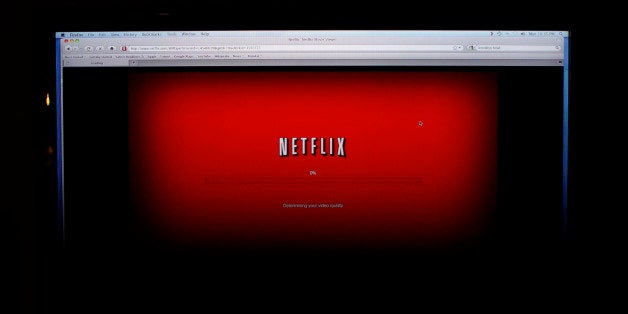 FILE - In this Nov. 22, 2010 photo, a movie selected from among Netflix's "Watch Instantly" titles begins to download on a home computer screen in New York. Netflix Inc., reports quarterly financial results Wednesday, Jan. 25, 2012, after the market close.(AP Photo/James H. Collins, file)