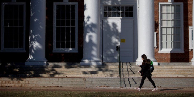 A student walks past Peabody Hall on the University of Virginia (UVA) campus in Charlottesville, Virginia, U.S., on Saturday, Jan. 17, 2015.This year's rush week at UVA, the prolonged annual rite in which fraternities and sororities recruit new members, carries fresh significance. Depending on who you talk to, the student rituals embody either an unchecked culture of sexual violence or a community victimized by stigma and false accusations. Photographer: Andrew Harrer/Bloomberg via Getty Images