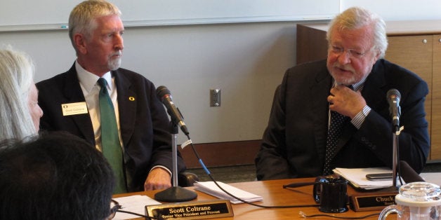 University of Oregon Interim President Scott Coltrane, left, and Board of Trustees Chairman Chuck Lillis speak to reporters on Thursday, Aug. 7, 2014 in Eugene, Ore. Coltrane was appointed following the abrupt resignation of former president Michael Gottfredson. (AP Photo/Jonathan J. Cooper)