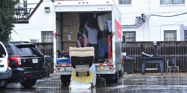 Students at the Sigma Alpha Epsilon house load up a moving truck with their belongings at the University of Oklahoma on Monday, March 9, 2015 in Norman, Okla. President David Boren of the University of Oklahoma severed the school's ties with a national fraternity on Monday and ordered that its on-campus house be shuttered after several members took part in a racist chant caught in an online video. (AP Photo/Nick Oxford)