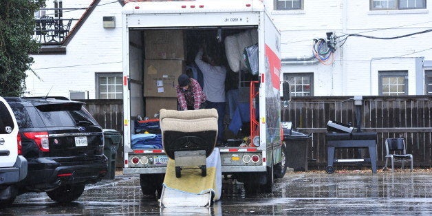 Students at the Sigma Alpha Epsilon house load up a moving truck with their belongings at the University of Oklahoma on Monda
