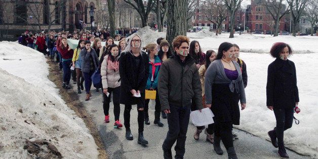 Hundreds of Brown University students march across campus, Wednesday, March 11, 2015, in Providence, R.I., to protest how the college handled recent sexual assault allegations. (AP Photo/Amy Anthony)