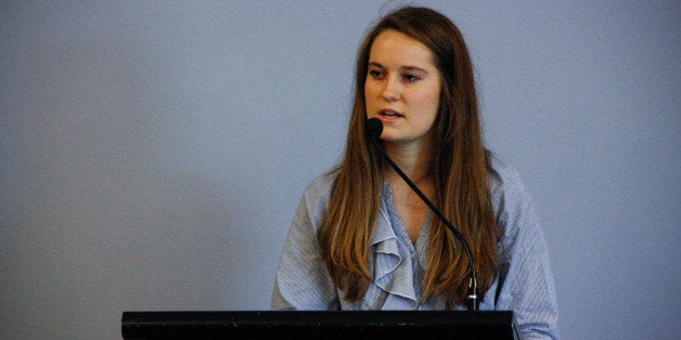 NEWL participant Alyssa Peterson delivers her team's opening statement at the Policy in Action mock legislative hearing.