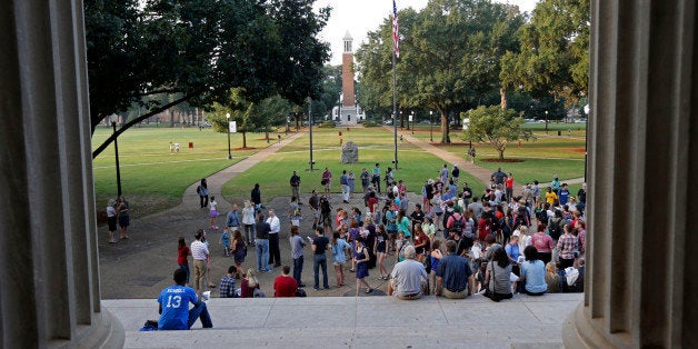 Univ. of Alabama students gather on the steps of the Amelia Gayle Gorgas Library to prepare for a march on the Rose Administration Building in protest of the university's segregated sorority system in Tuscaloosa, Ala., Wednesday, Sept. 18, 2013. About 400 students and faculty marched across the campus to oppose racial segregation among its Greek-letter social organizations. (AP Photo/Dave Martin)