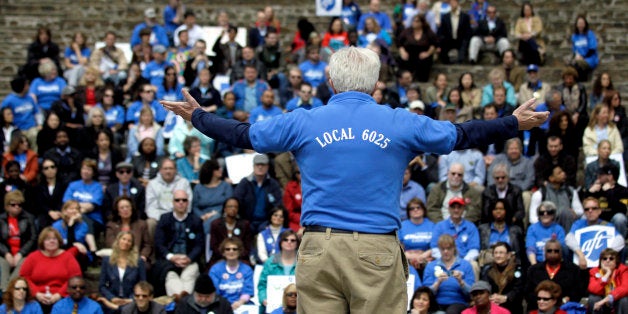 Robert Noonan, president of the Montclair State University Federation of Adjunct Faculty, talks to people in attendance at a rally on campus, Wednesday, April 25, 2012, in Montclair, N.J. Union-sponsored rallies are being held at eight college campuses around New Jersey this week. ALF-CIO President Charles Wowkenech says the action days serve as a rallying cry for increased state funding for higher education and fair labor negotiations on campuses. (AP Photo/Julio Cortez)