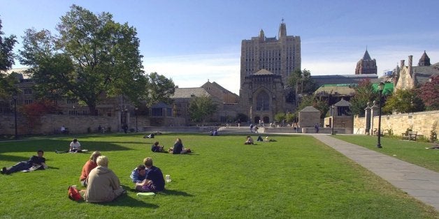 FILE -- In an Oct. 11, 2000 file photo Yale University students and others spend a fall afternoon on Yale University's Cross Campus in New Haven, Conn. In the background is the Sterling Memorial Library, the main library for the university. A new study has found that five times as many high school and college students are dealing with anxiety and other mental health issues than youth of the same age who were studied in the Great Depression era. (AP Photo/Bob Child/file)