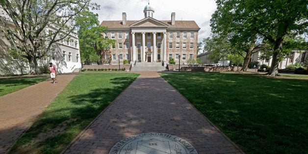 In this photo taken Monday, April 20, 2015, a sidewalk leads to the South Building on campus at The University of North Carolina in Chapel Hill, N.C. (AP Photo/Gerry Broome)